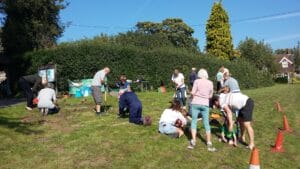 Volunteers planting daffodil bulbs